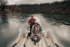 People riding on boat as it moves through the water